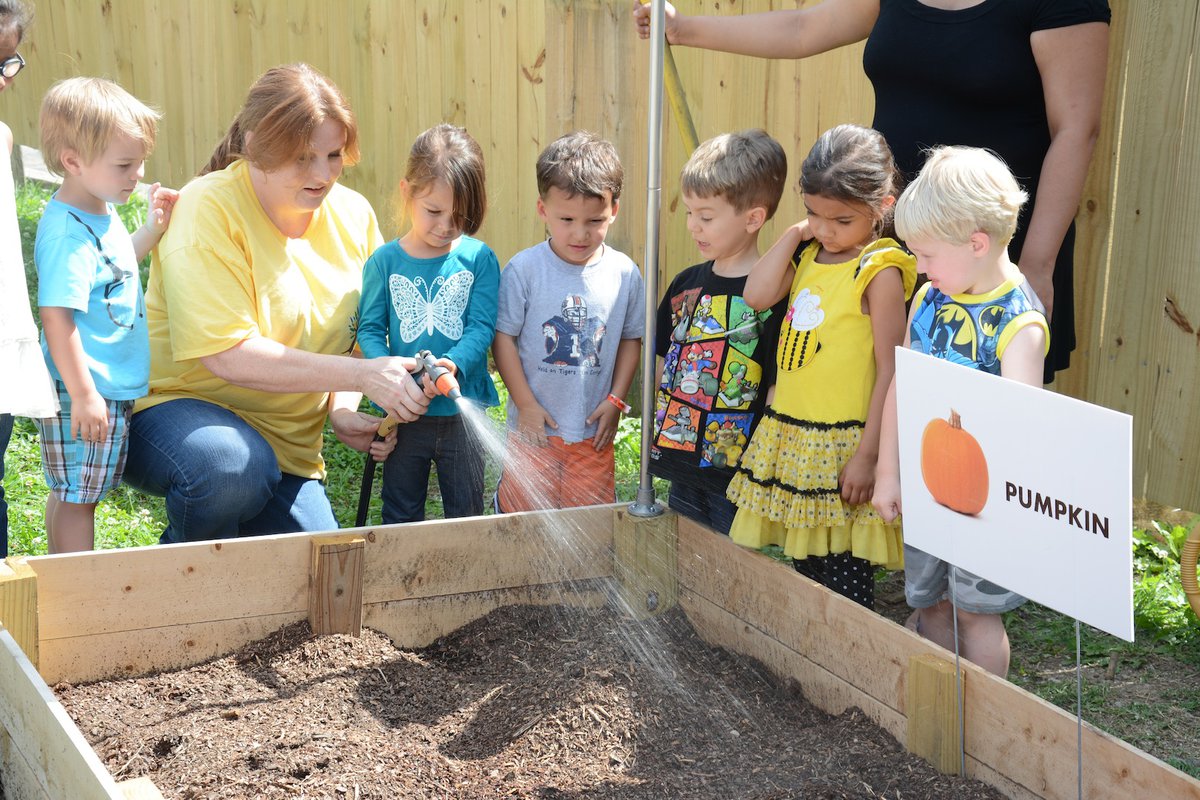 Children enjoy community garden at Rocky Ridge Learning Center ...